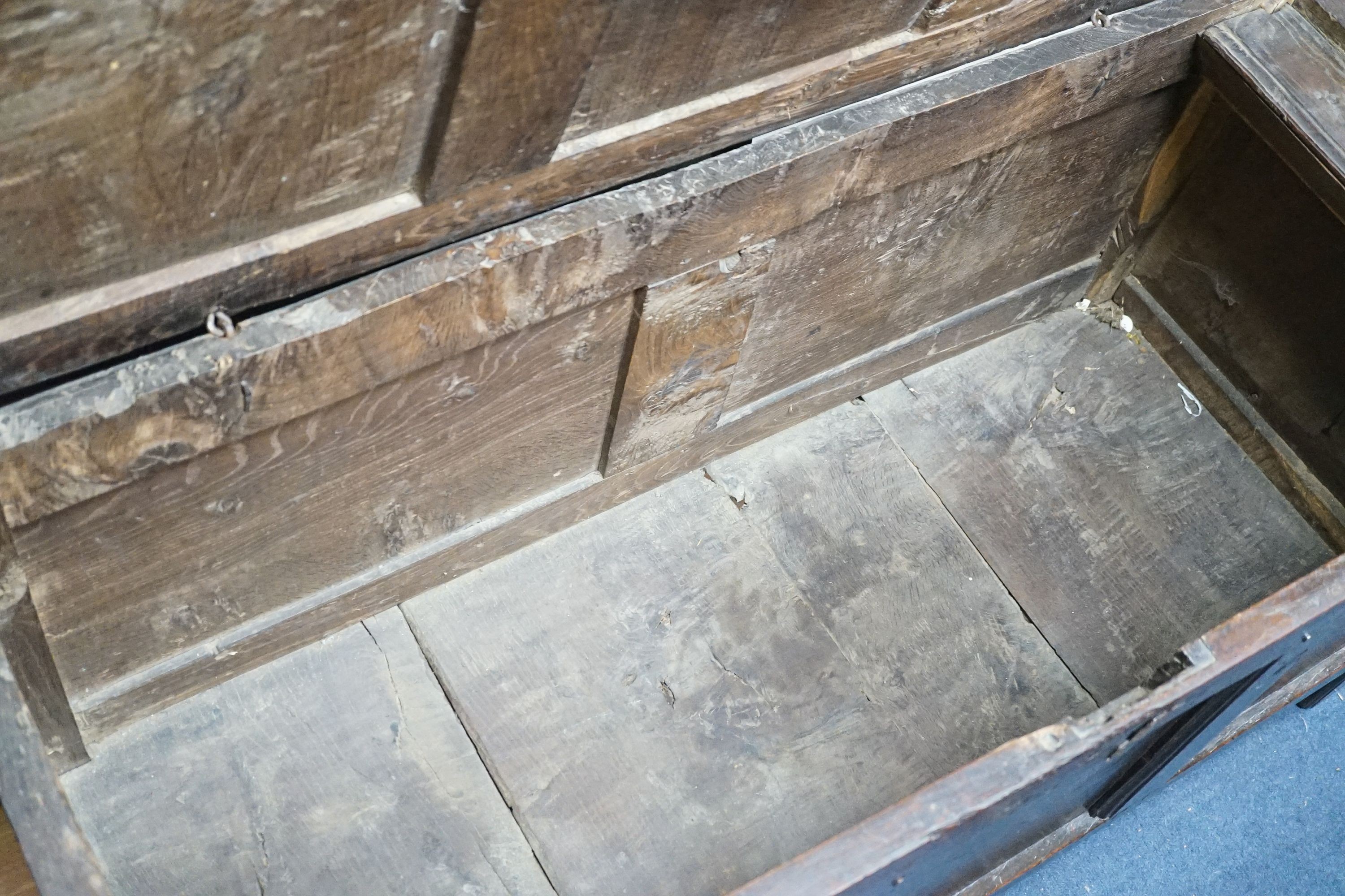 A late 17th century triple panelled oak coffer, length 126cm, depth 51cm, height 63cm